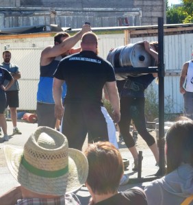 Lindsay gets her 130lbs keg over a 50" bar.