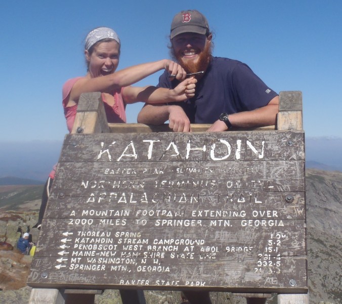 Lindsay cutting my 15 month beard off at the summit of Mt Katahdin, the end of our Appalachian Trail Journey