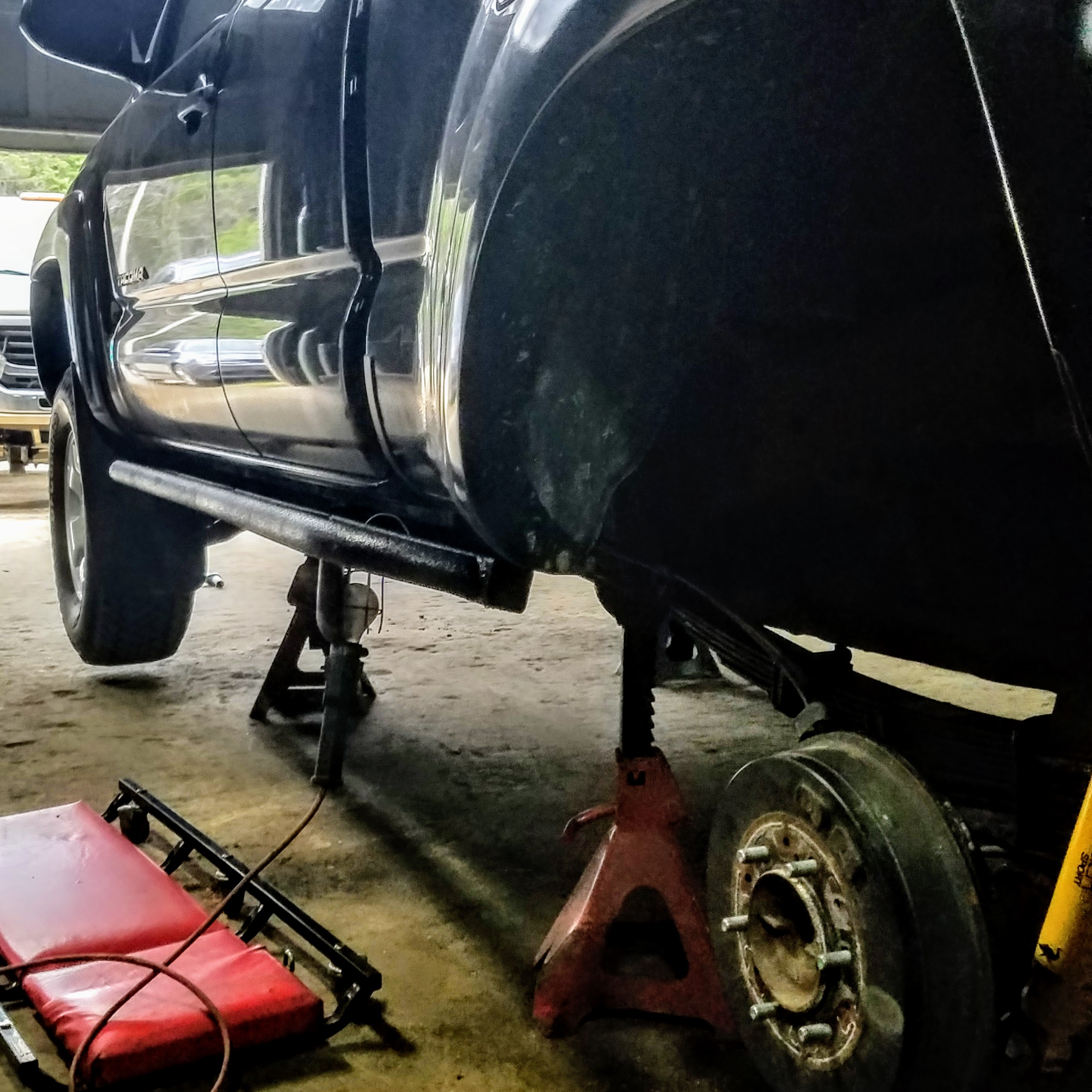 expedition overland truck build rock slider installation